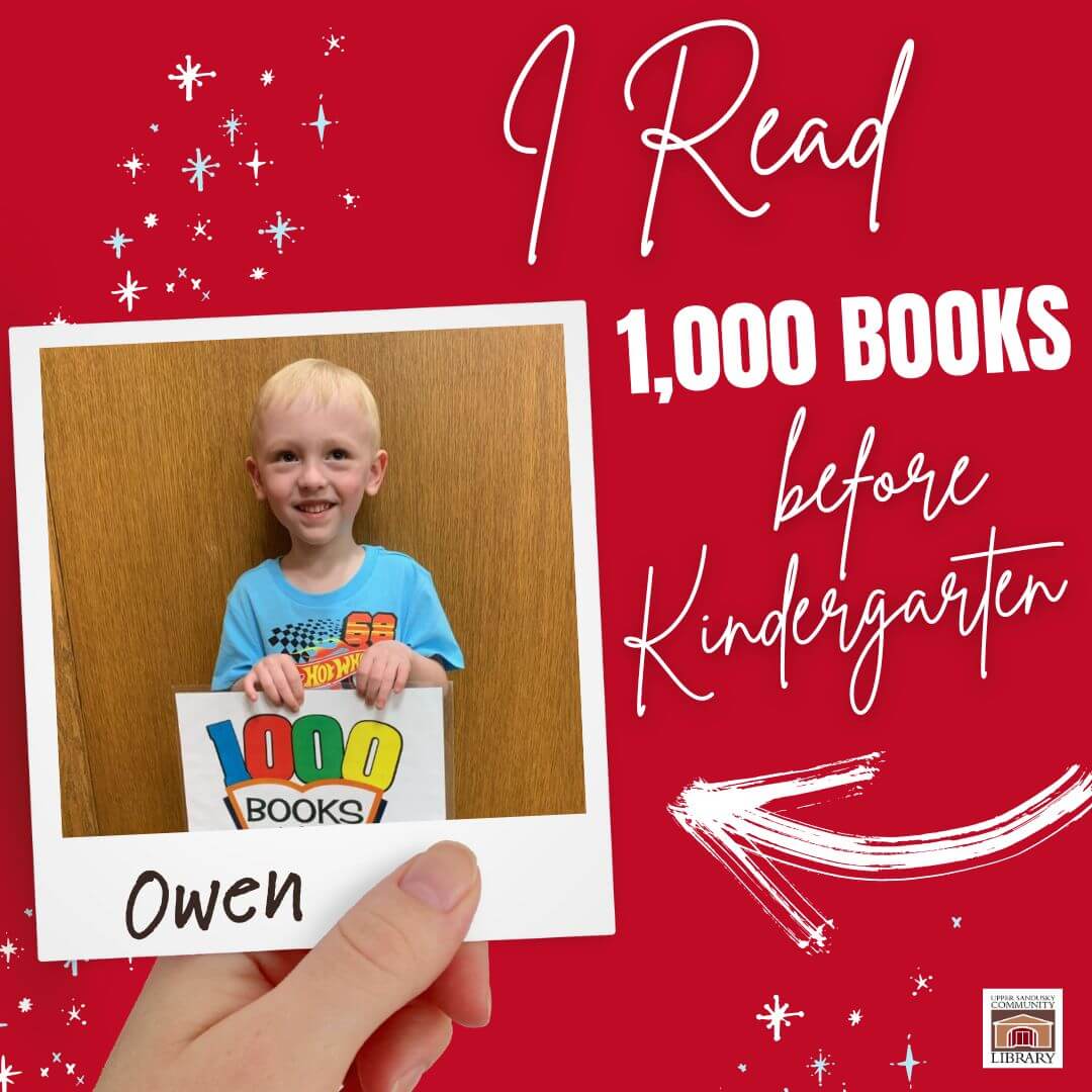 Hand holding a Polaroid of a little book with the name Owen written on the photo. Text says I Read 1,000 Books Before Kindergarten.
