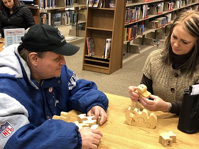 patrons putting together puzzles