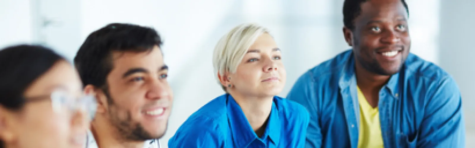 A group of adults gathered together to learn. 