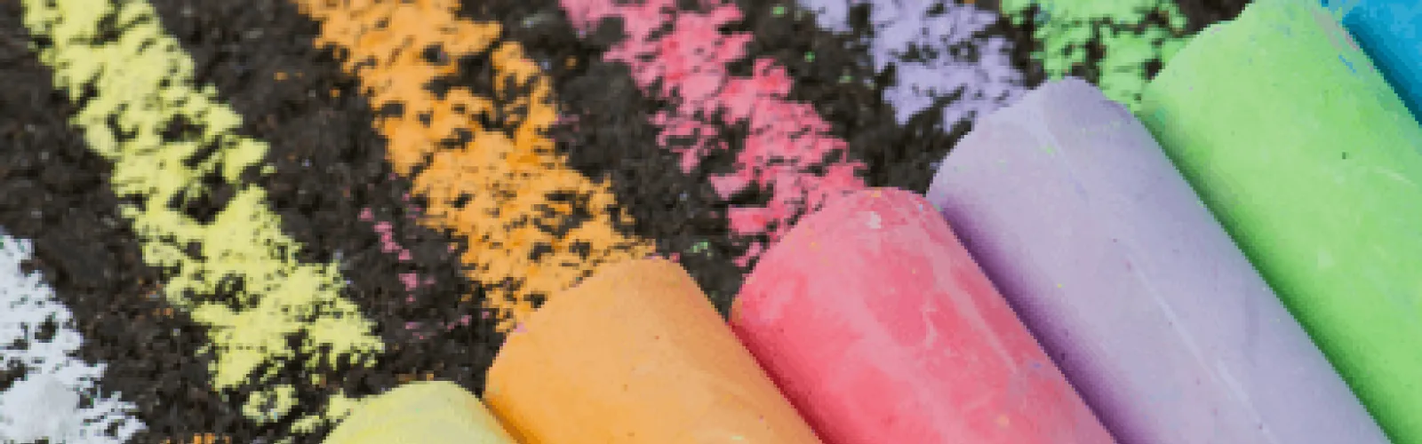 Pieces of colorful chalk drawing lines. 